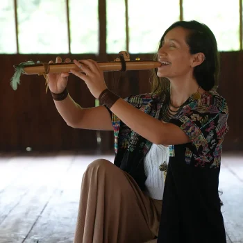 ayahusaca retreat attendee playing a musical instrument
